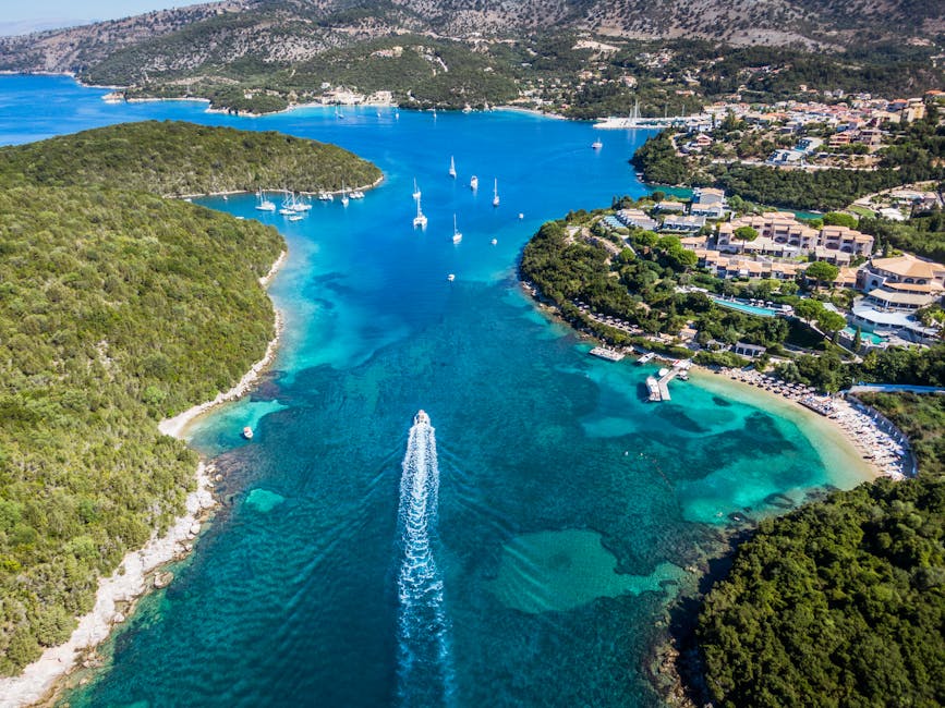 Explore the stunning aerial view of Syvota's emerald coast, with vibrant blue waters and lush landscapes.